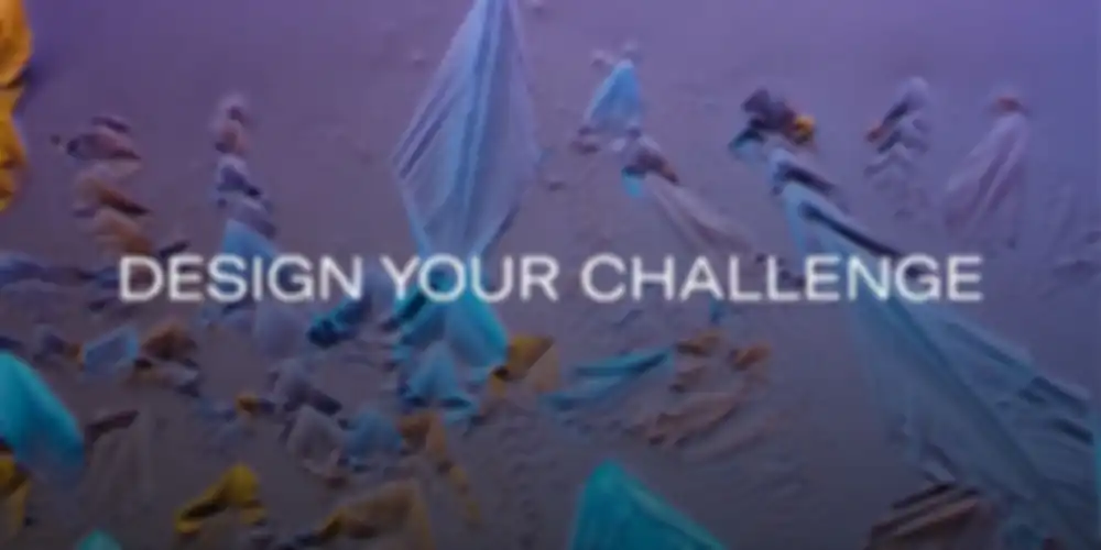 A colorful, abstract crystal structure featuring the words "Design your Challenge"