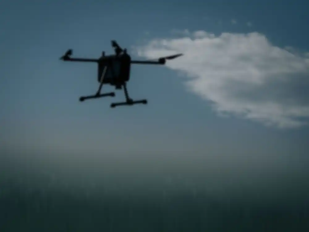 A drone flies in the sky