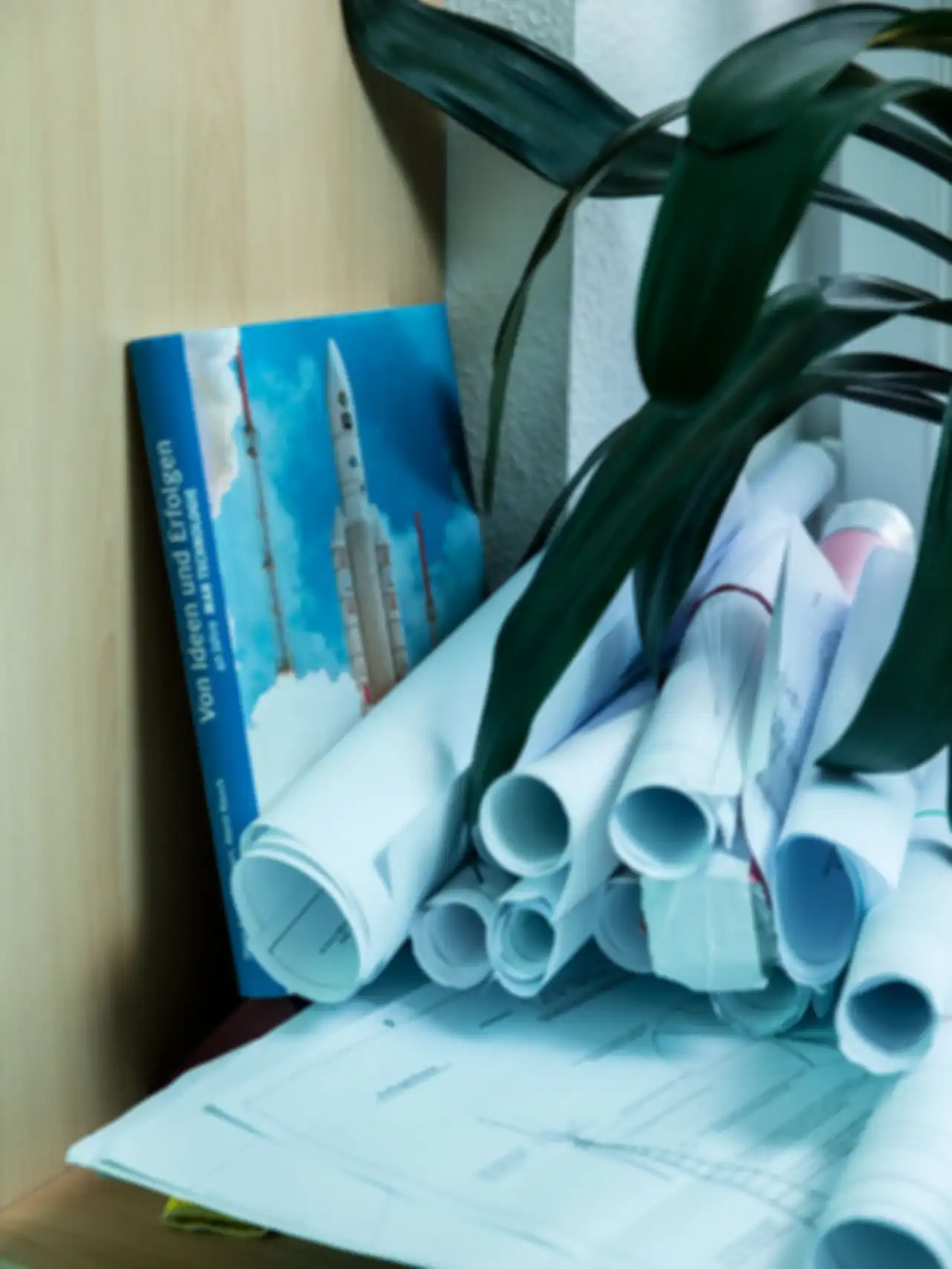 Documents related to the wind turbine are rolled up and stacked on top of each other
