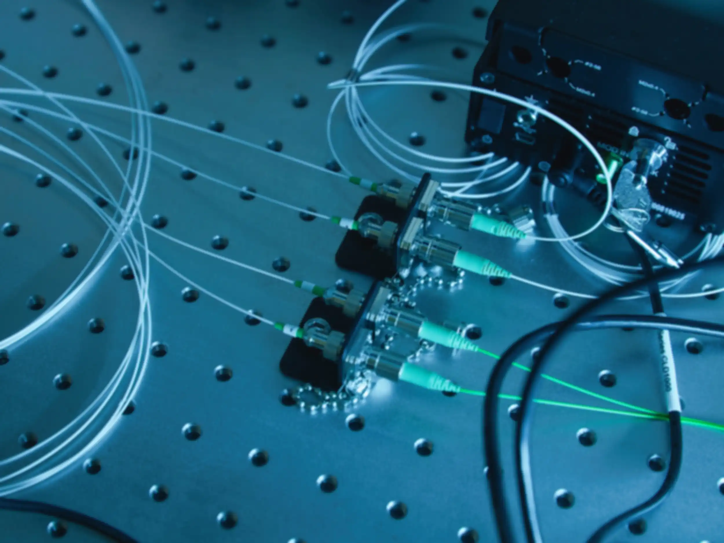 Close-up of various cables connected on a perforated base