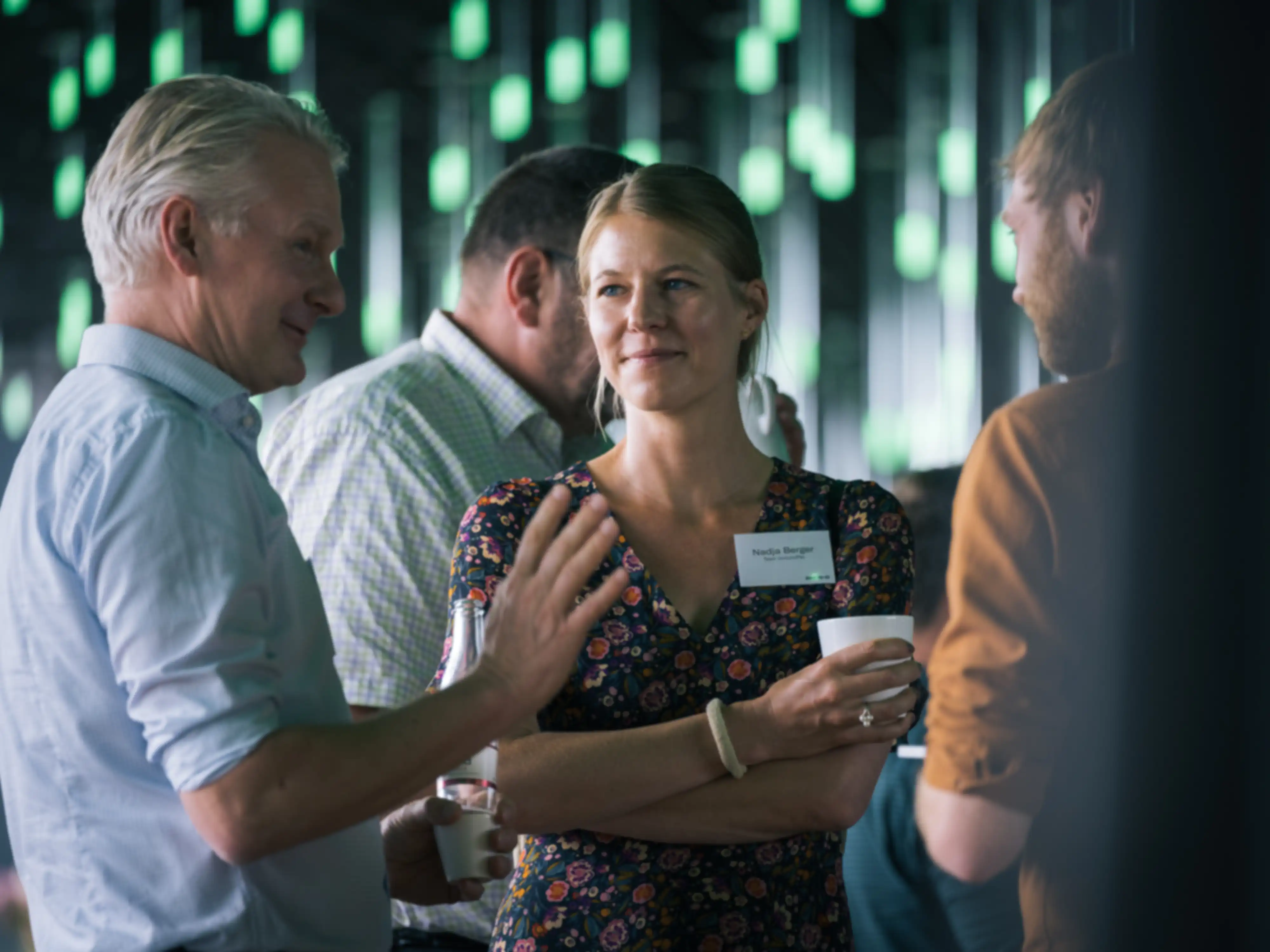 Three people in conversation