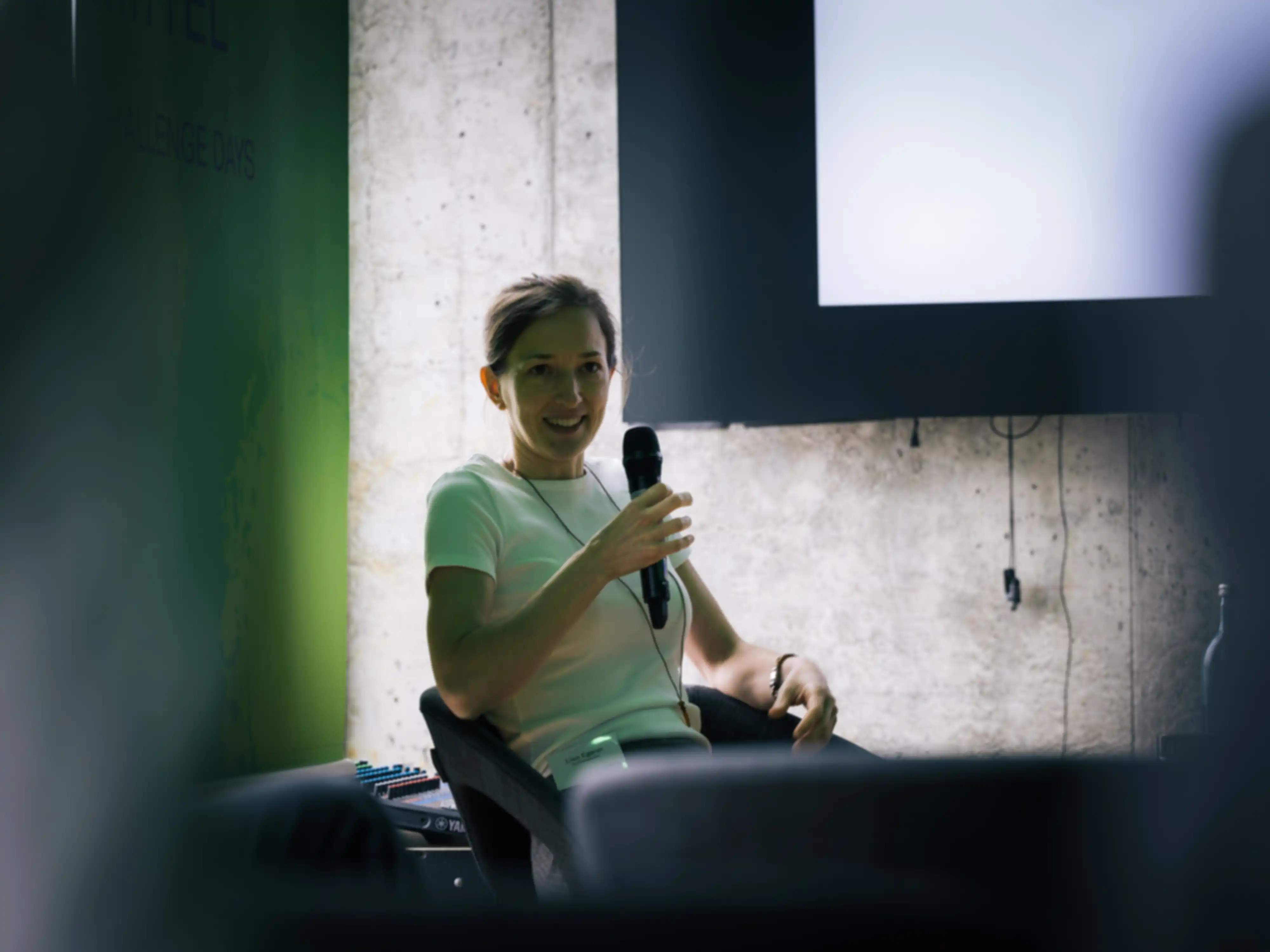 A woman is giving a lecture
