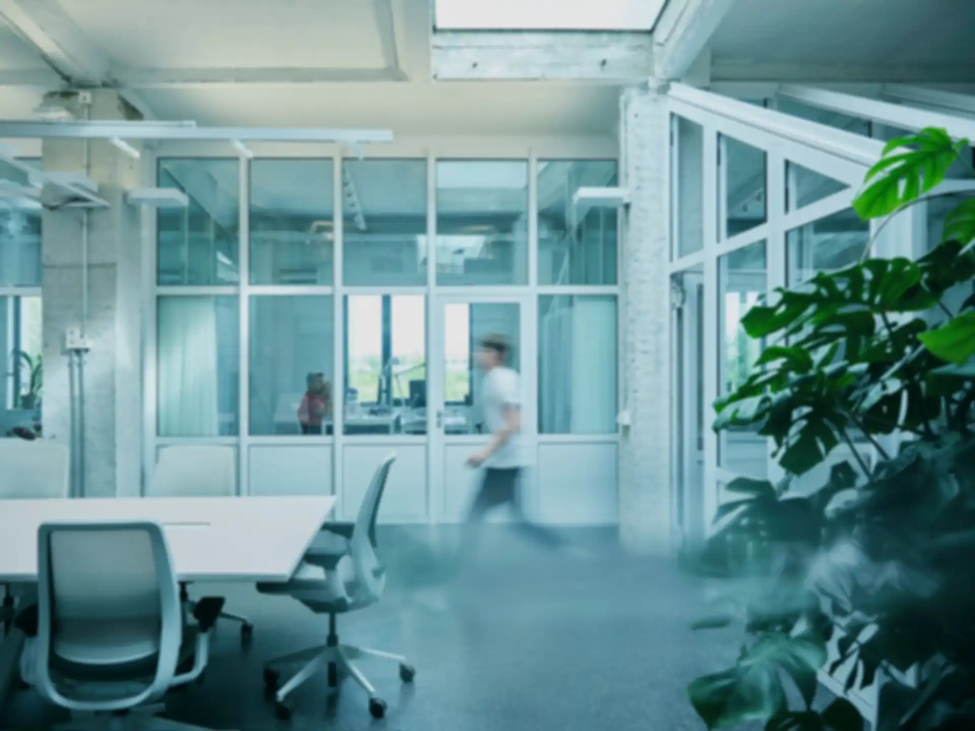 A person is walking through the SPRIND office.