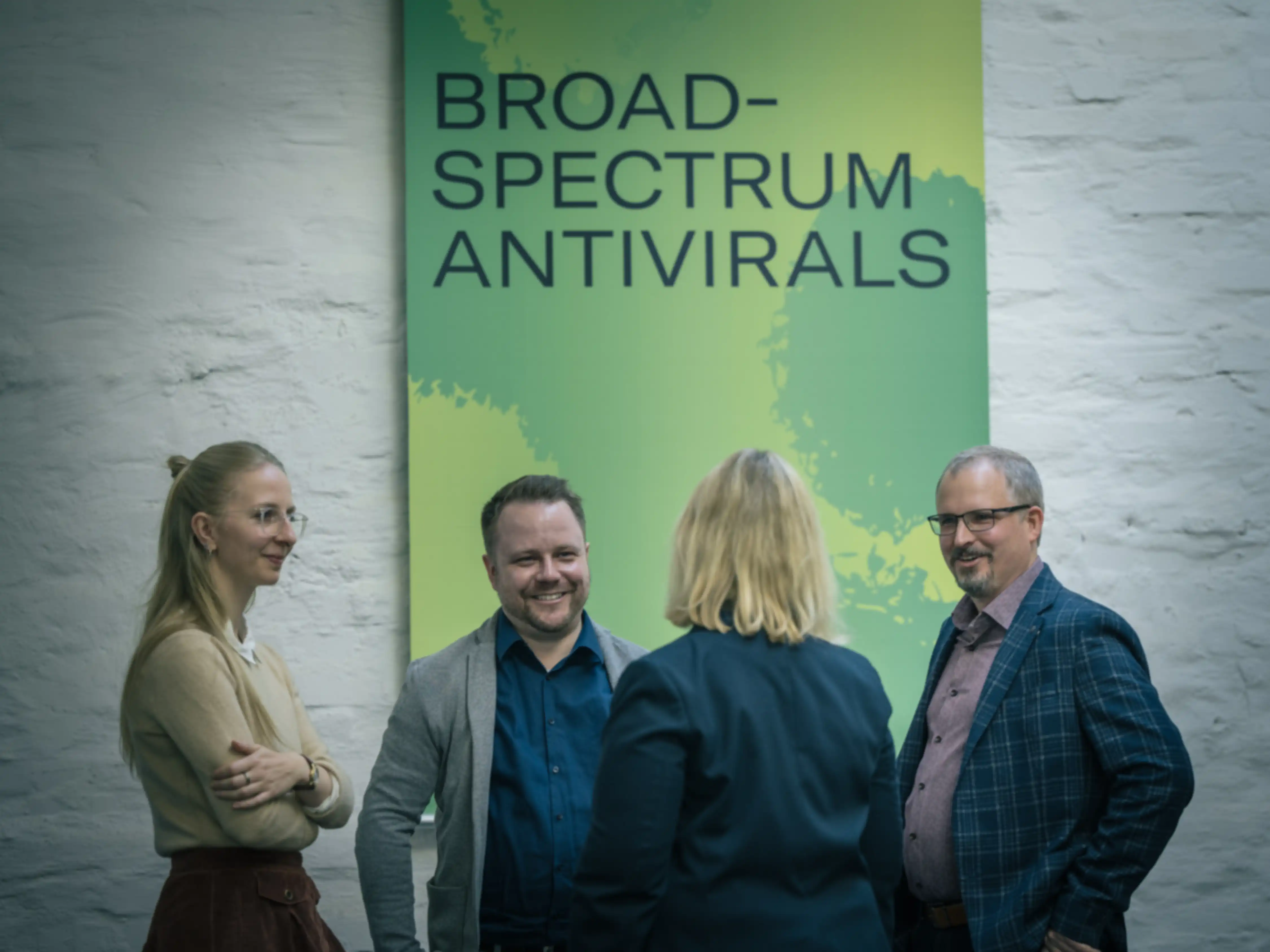 Three people in conversation