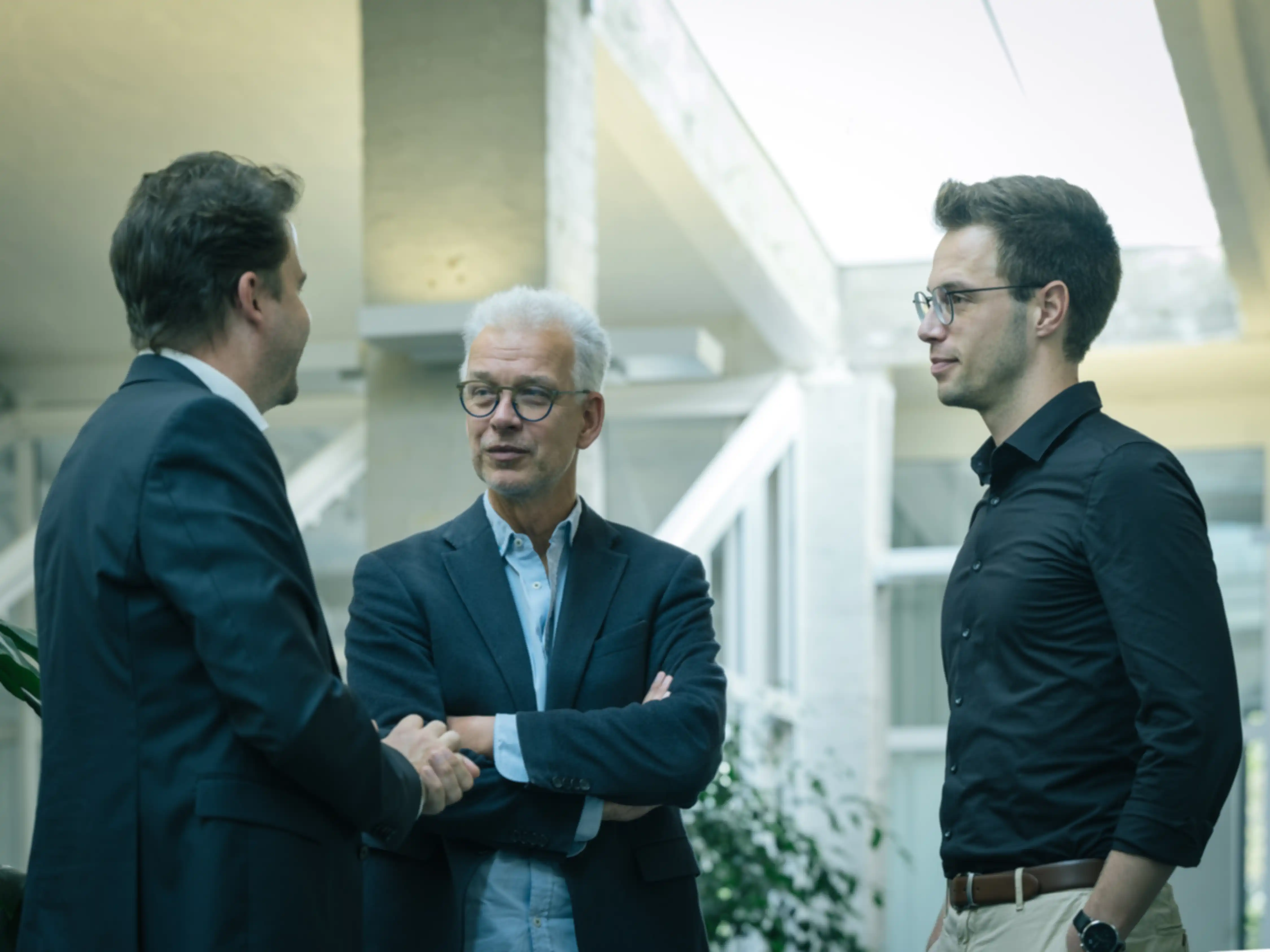 Three people in conversation