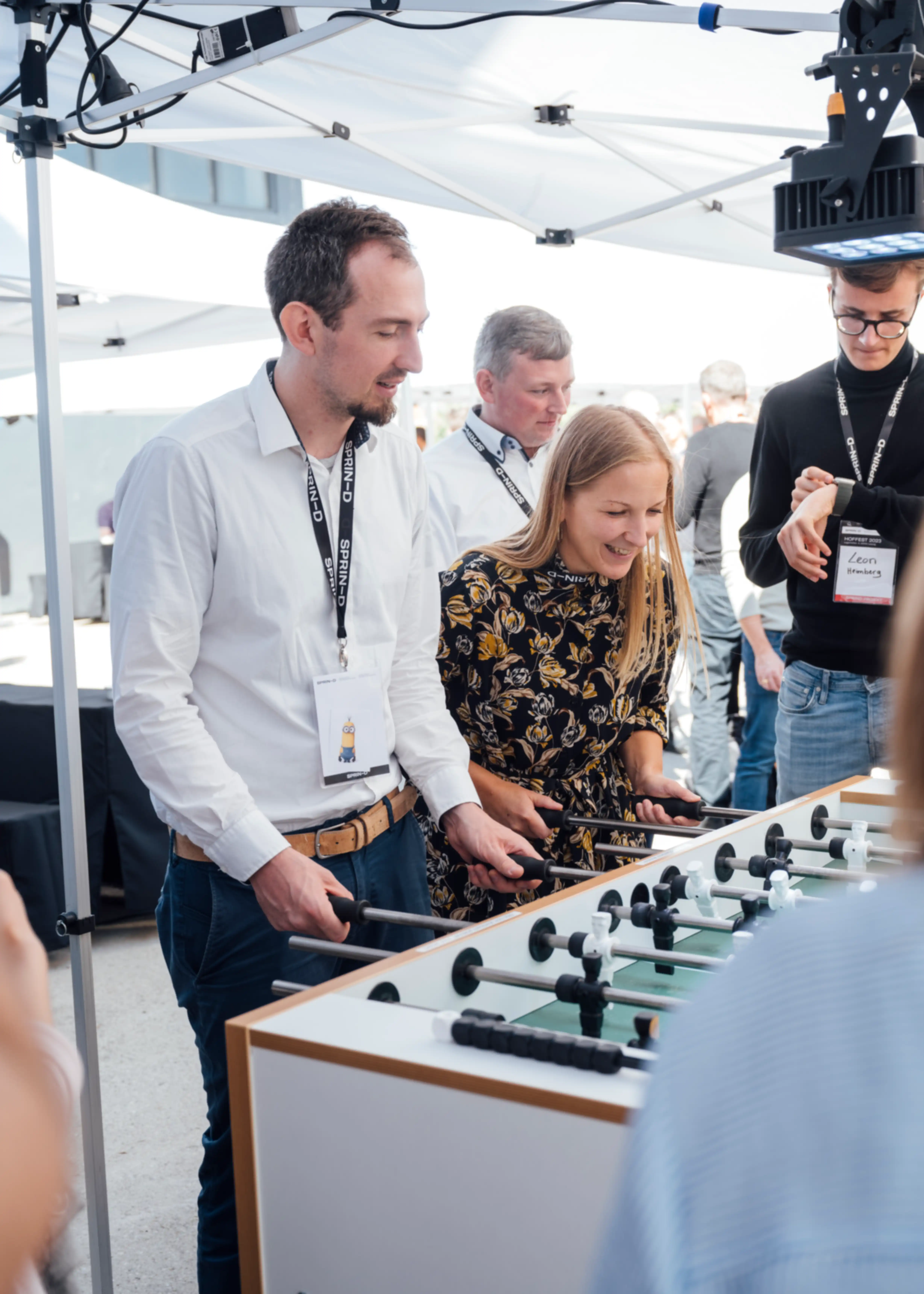 Several people playing table football