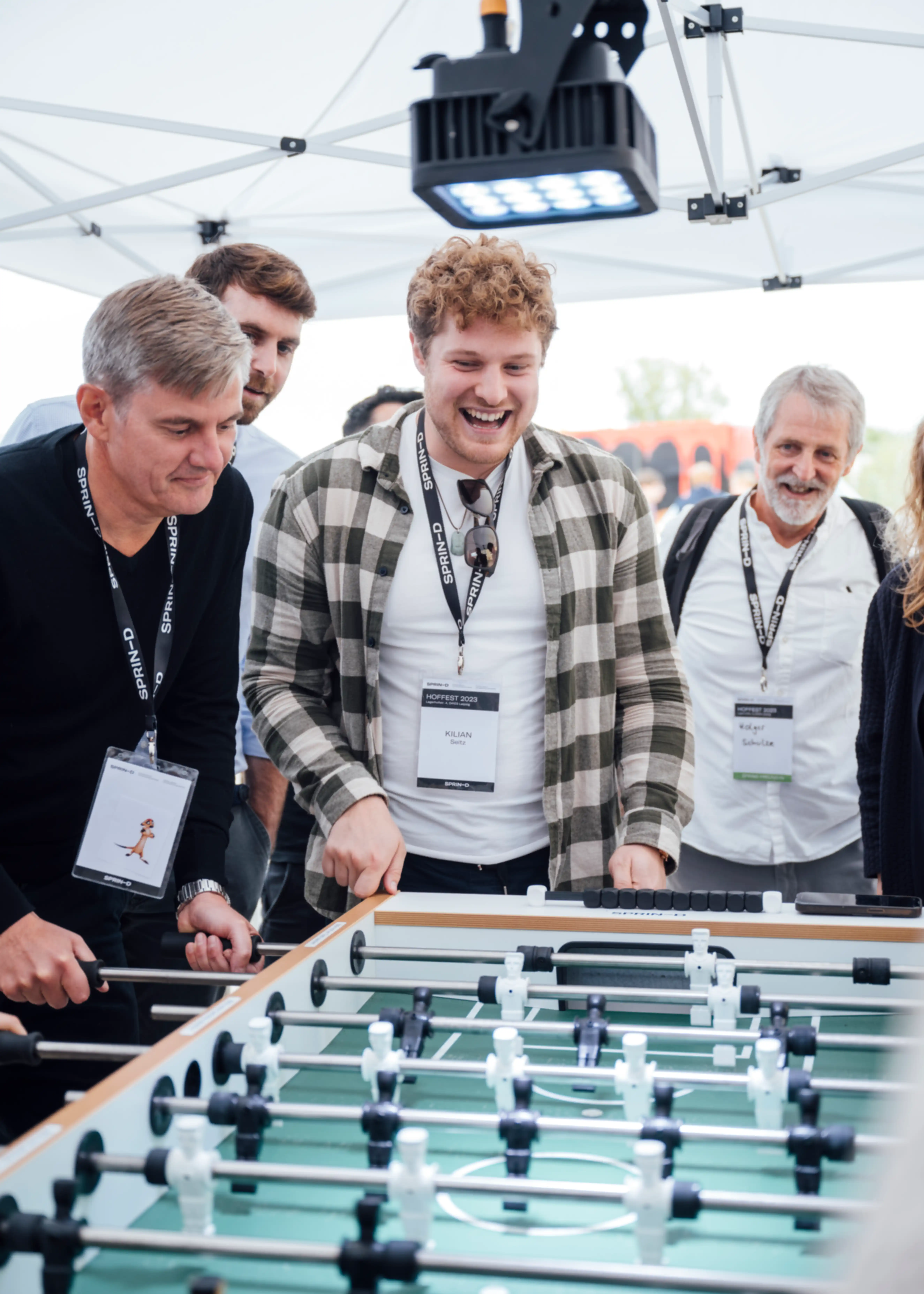 Three people playing table football