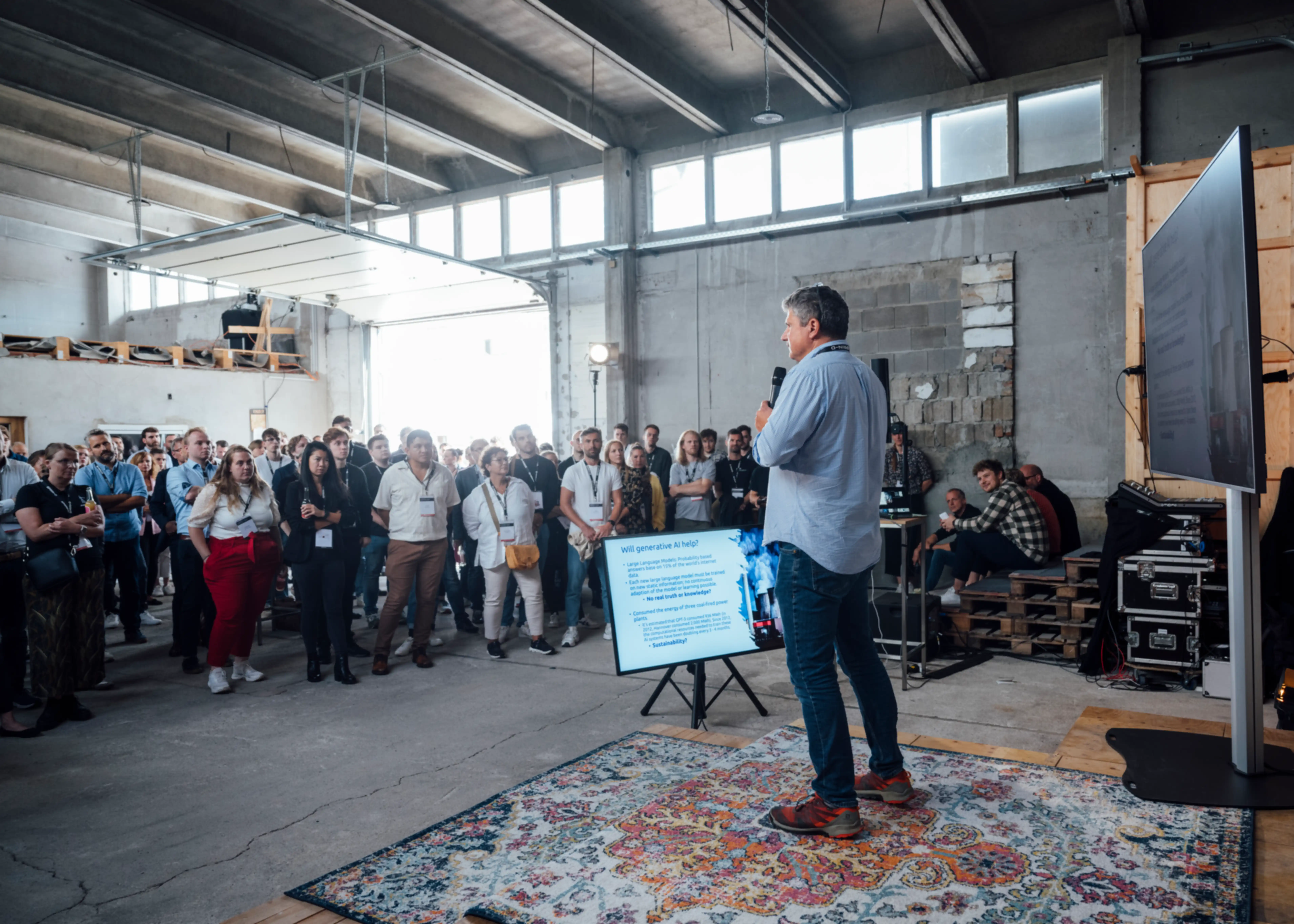 A person is giving a presentation in a hall